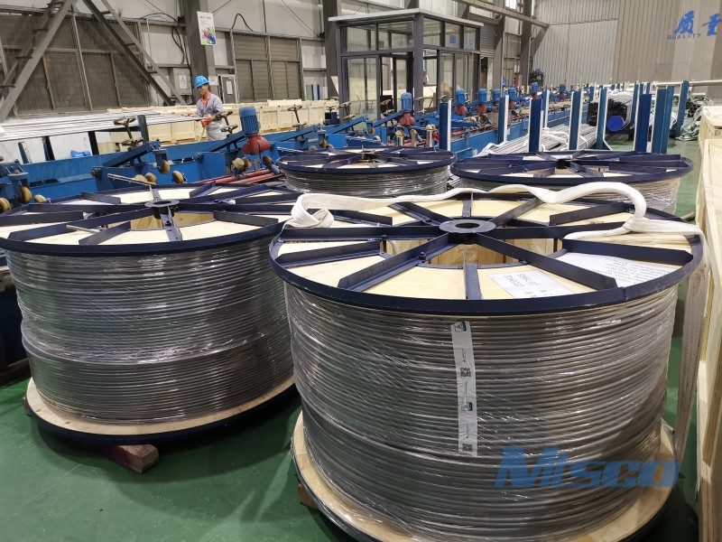 Welded coiled tubing in spiral wound heat exchanger